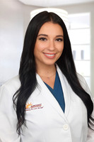 Danie Ely 1 Headshot Office Background