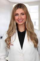 Jenna Caputo Headshot Office Background 1