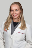 Jen Hickman Headshot Gray Background