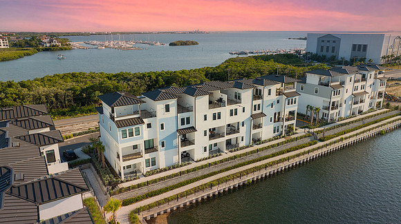 Dev 5351 Bridge St. Unit 100 Aerial-Twilight