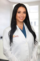Danie Ely 2 Headshot Office Background
