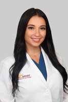 Danie Ely 1 Headshot Gray Background